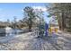 Community playground near a pond, featuring modern play equipment and scenic views at 7806 Park Gate Dr, North Charleston, SC 29418