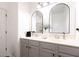 Elegant bathroom vanity featuring dual sinks, modern lighting, and plenty of storage at 9715 Brandishing Rd, Ladson, SC 29456