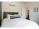 Bright bedroom featuring a comfortable bed, hardwood headboard, and tasteful decor at 9715 Brandishing Rd, Ladson, SC 29456