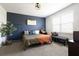 Beautiful bedroom with a stylish bed, a blue accent wall, and natural lighting at 9715 Brandishing Rd, Ladson, SC 29456