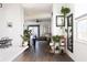 Bright hallway with stylish decor and plants leading to the living area at 9715 Brandishing Rd, Ladson, SC 29456