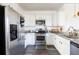 Modern kitchen featuring stainless steel appliances, granite countertops, and white cabinets at 9715 Brandishing Rd, Ladson, SC 29456