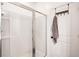 Modern walk-in shower with a glass door and white tile at 9715 Brandishing Rd, Ladson, SC 29456