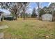Spacious backyard featuring a shed, mature trees, and a well-maintained lawn at 102 Eastover Cir, Summerville, SC 29483