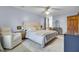 Light-filled bedroom features a ceiling fan, neutral walls, and comfortable sitting area at 102 Eastover Cir, Summerville, SC 29483