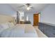 Bedroom boasts natural light, ceiling fan, and a view into the attached bathroom at 102 Eastover Cir, Summerville, SC 29483