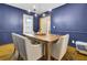Elegant dining room with blue walls, wood floors, and a large rustic table at 102 Eastover Cir, Summerville, SC 29483