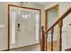 Welcoming entryway featuring a sidelit front door and hardwood stairs with a baby gate at 102 Eastover Cir, Summerville, SC 29483
