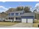 Inviting two-story home with a cozy front porch and a spacious two-car garage at 102 Eastover Cir, Summerville, SC 29483
