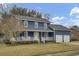 Attractive blue two-story home with a classic front porch and a convenient two-car garage at 102 Eastover Cir, Summerville, SC 29483
