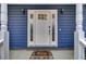 Elegant front door with sidelights and a welcome mat, creating a warm entry at 102 Eastover Cir, Summerville, SC 29483