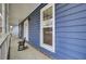 Relaxing front porch with rocking chairs and blue wood paneling, perfect for enjoying the outdoors at 102 Eastover Cir, Summerville, SC 29483