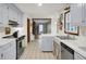 Spacious kitchen with blue cabinets, white countertops, and stainless steel appliances at 102 Eastover Cir, Summerville, SC 29483