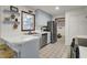 Well-lit kitchen featuring stainless steel appliances and a tiled floor at 102 Eastover Cir, Summerville, SC 29483