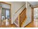 Wooden staircase with safety gate overlooks the home's hardwood floor at 102 Eastover Cir, Summerville, SC 29483