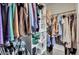 Bright walk-in closet features custom shelving and hanging racks for optimal storage space at 102 Eastover Cir, Summerville, SC 29483