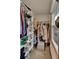 Well-organized walk-in closet offers ample storage with shelving and a hanging rod, plus window at 102 Eastover Cir, Summerville, SC 29483