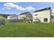 Spacious backyard with green lawn, wooden fence, and playground equipment at 1052 Whitlow Blvd, Summerville, SC 29483
