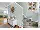 Inviting entryway featuring neutral walls, a staircase, and a charming accent bench at 1052 Whitlow Blvd, Summerville, SC 29483