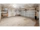 Spacious garage with a visible garage door mechanism and ample storage shelving at 1052 Whitlow Blvd, Summerville, SC 29483
