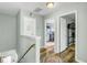 Upstairs hallway featuring hardwood floors with an open view into the bedrooms at 1052 Whitlow Blvd, Summerville, SC 29483