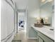 Hallway view of a bathroom with vanity and bedroom at the end of the hallway at 1052 Whitlow Blvd, Summerville, SC 29483