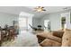 Open-concept living area with wood floors, seating and dining table for flexible living at 1052 Whitlow Blvd, Summerville, SC 29483