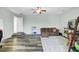 Open-concept living area with wood floors, seating and play area for flexible living at 1052 Whitlow Blvd, Summerville, SC 29483