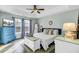 Stylish main bedroom with tray ceiling, ample natural light, and a calming color palette at 1052 Whitlow Blvd, Summerville, SC 29483