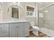 Bright bathroom featuring a glass enclosed shower and a vanity with lots of storage at 112 E Huron Ave # C, Folly Beach, SC 29439