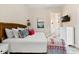 Bedroom features a large bed and an ensuite bathroom at 112 E Huron Ave # C, Folly Beach, SC 29439