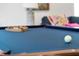 Bright game room features a felt pool table ready for play at 112 E Huron Ave # C, Folly Beach, SC 29439