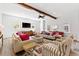 Comfortable living room with stylish seating, textured walls, and ceiling fan at 112 E Huron Ave # C, Folly Beach, SC 29439