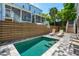 Beautiful pool area with a nice privacy fence and lounge chairs, a perfect spot for outdoor enjoyment at 112 E Huron Ave # C, Folly Beach, SC 29439