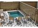 Relax by the pool, surrounded by a modern horizontal fence and beautiful paved stone at 112 E Huron Ave # C, Folly Beach, SC 29439