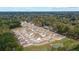 An aerial view of a new construction community with ponds and forest views at 114 River Hill Rd, Goose Creek, SC 29445