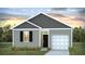 Charming single-story home with a garage and landscaped front yard at 114 River Hill Rd, Goose Creek, SC 29445