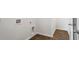 Hallway with wood-look floors and white trim, leading to an open doorway at 114 River Hill Rd, Goose Creek, SC 29445