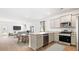 Charming kitchen and living space featuring an island, dining area, and stainless steel appliances at 114 River Hill Rd, Goose Creek, SC 29445