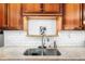 Close up on the kitchen sink with stainless steel double basin and subway tile backsplash at 114 Sharon Dr, Walterboro, SC 29488