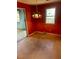 Dining room with a window, red walls, and a hanging light fixture at 1146 Brigantine Dr, Charleston, SC 29412