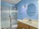 Bathroom featuring a glass-enclosed shower, neutral-toned vanity with a sink and oval mirror at 115 St Awdry St, Summerville, SC 29485