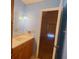 Well-lit bathroom featuring a vanity with sink and neutral-toned countertop at 115 St Awdry St, Summerville, SC 29485