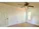 This bedroom features neutral walls, a ceiling fan, and a sunlit window at 115 St Awdry St, Summerville, SC 29485
