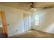 This carpeted bedroom features a ceiling fan, closet, and a window at 115 St Awdry St, Summerville, SC 29485