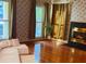 Comfortable living room with hardwood floors, cozy fireplace, and natural lighting at 115 St Awdry St, Summerville, SC 29485