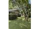 Spacious backyard featuring a brick exterior and a well-maintained lawn at 125 Azalea Dr, Summerville, SC 29485