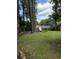 A sprawling backyard features a chicken coop and lots of room for gardening and outdoor activities at 125 Azalea Dr, Summerville, SC 29485