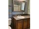 Bathroom vanity with wood cabinets and a framed mirror at 125 Azalea Dr, Summerville, SC 29485