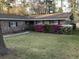 Charming brick home with a well-manicured lawn and mature trees at 125 Azalea Dr, Summerville, SC 29485